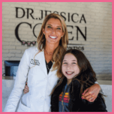 Dr Jessica Cohen hugging patient in black jacket