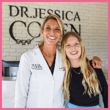 Dr Jessica Cohen hugging patient with long sleeved black shirt